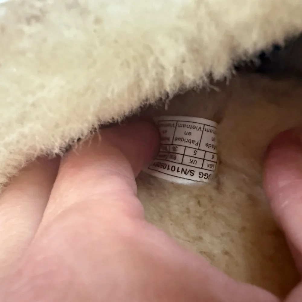 UGG Kids Tan Shearling Boots with Navy Bow Accents
